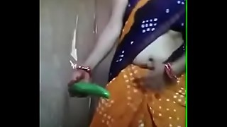 Desi aunty playing with cucumber